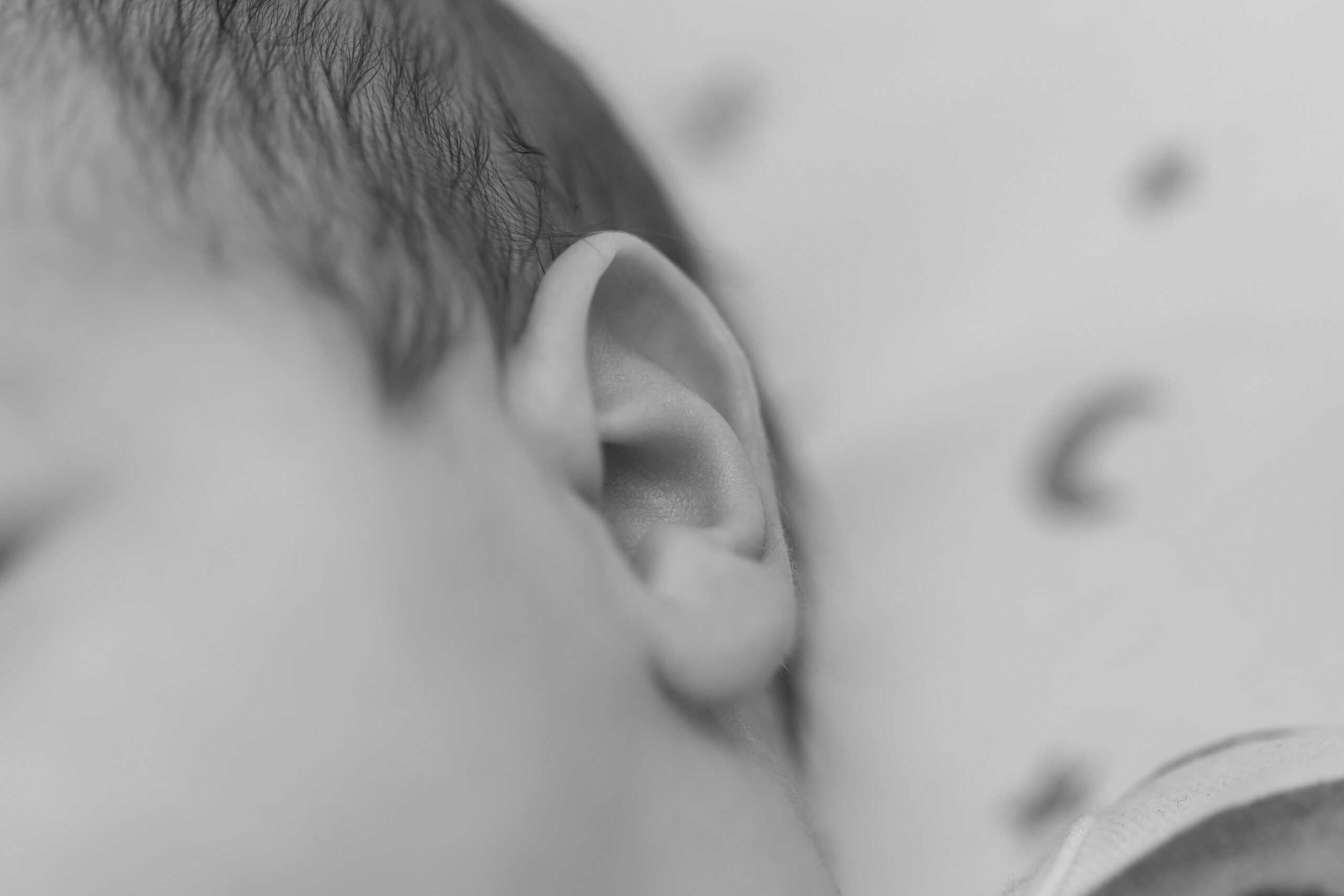 child with hearing aid smiling