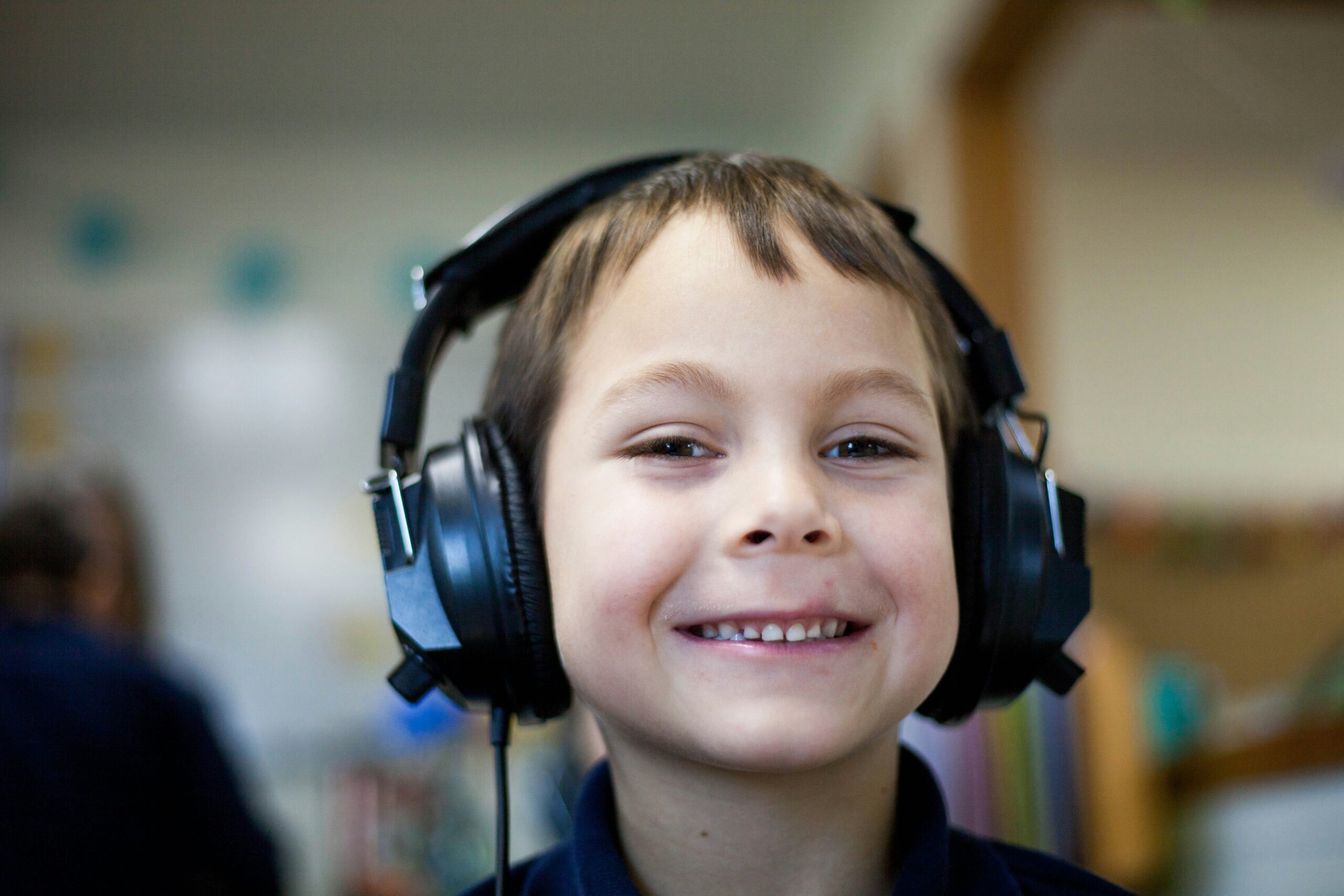 Infographic showing statistics on pediatric hearing loss and aid usage